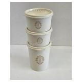 Three vintage Tupperware storage canisters