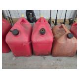 Three vintage plastic 5 gallon gas cans
