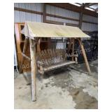 Custom built log patio swing set with awning