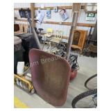 Vintage wood handled steel wheelbarrow