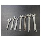 Seven assorted adjustable wrenches