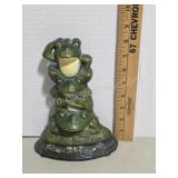 Decorative cast iron frog door stop
