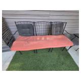 Black wrought iron patio bench and side table