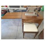 Vintage Singer sewing machine cabinet with chair