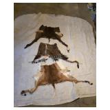 Three assorted partial animal hides