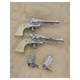 Vintage cap guns and cowboy boots salt pepper