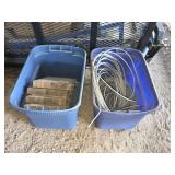 Two storage totes with assorted cable and blocks