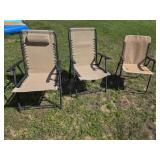 Three assorted metal folding lawn chairs