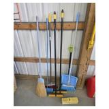Assorted brooms and scrub brushes