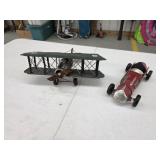 Two decorative metal airplane and race car