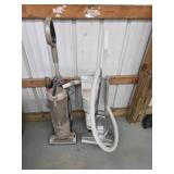 Pair of upright vacuums, Zhark and Kirby