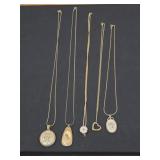 Five vintage gold tone pendant necklaces