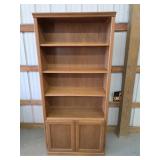 Oak two-door bookshelf with adjustable shelves,