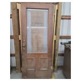 Vintage oak solid core door with glass lite panel