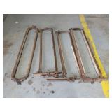 Four vintage antique cattle stanchions