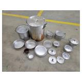 Large stock pot with assorted camping pots pans