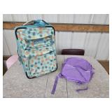 JanSport 22-in roller carry-on bag and purple
