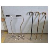 Lot of five vintage metal and wooden walking