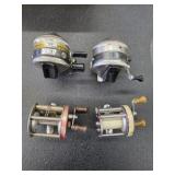 Four vintage Zebco 33 fishing reels and two