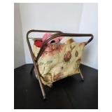 Vintage sewing storage stand with assorted