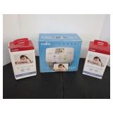 Canon Selphy CP760 compact photo printer with two