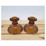 Vintage amber glass candlestick holders in the