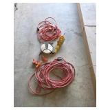 Retractable extension cord reel trouble light and