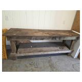 Custom built wood frame workbench with plate