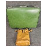 Green suitcase with portable luggage cart