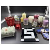 Assorted candles and votive holders