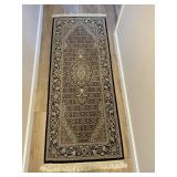 Authentic oriental rug dark colors.
