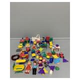 Assorted plastic childrenï¿½s toys/Doll house
