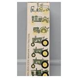 Seven John Deere Miniture Toy Tractors