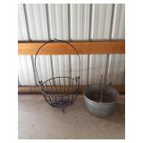 Galvanized Metal Bucket In A Black Wire Holder