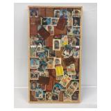 A wooden display of Vintage Topps cards