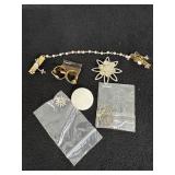 Sweater clips, Golden hoop earrings