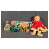 Celluloid Baby Doll Wearing A Crochet Dress, Sling