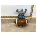 Republican elephant mascot holding football with Jim Beam bottle