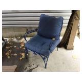 Antique metal chair with cushions
