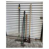 Two edgers two hoes and gravel rake