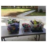 Fake flowers in two storage containers with lids