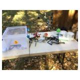 Various gardening tools and supplies in container