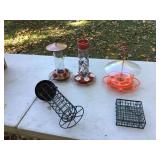 Various styles of nectar containers for hummingbirds