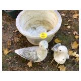 Two cement seagulls damaged