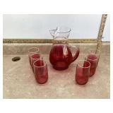 Vintage red glass pitcher and glasses
