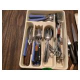 Kitchen utensils organized in compartments