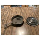 Vintage cast iron skillet with metal lid