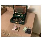 Assorted costume jewelry in box