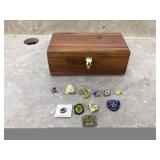 Collection of US Navy pins in cedar chest