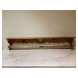 A shelf that displays quilts